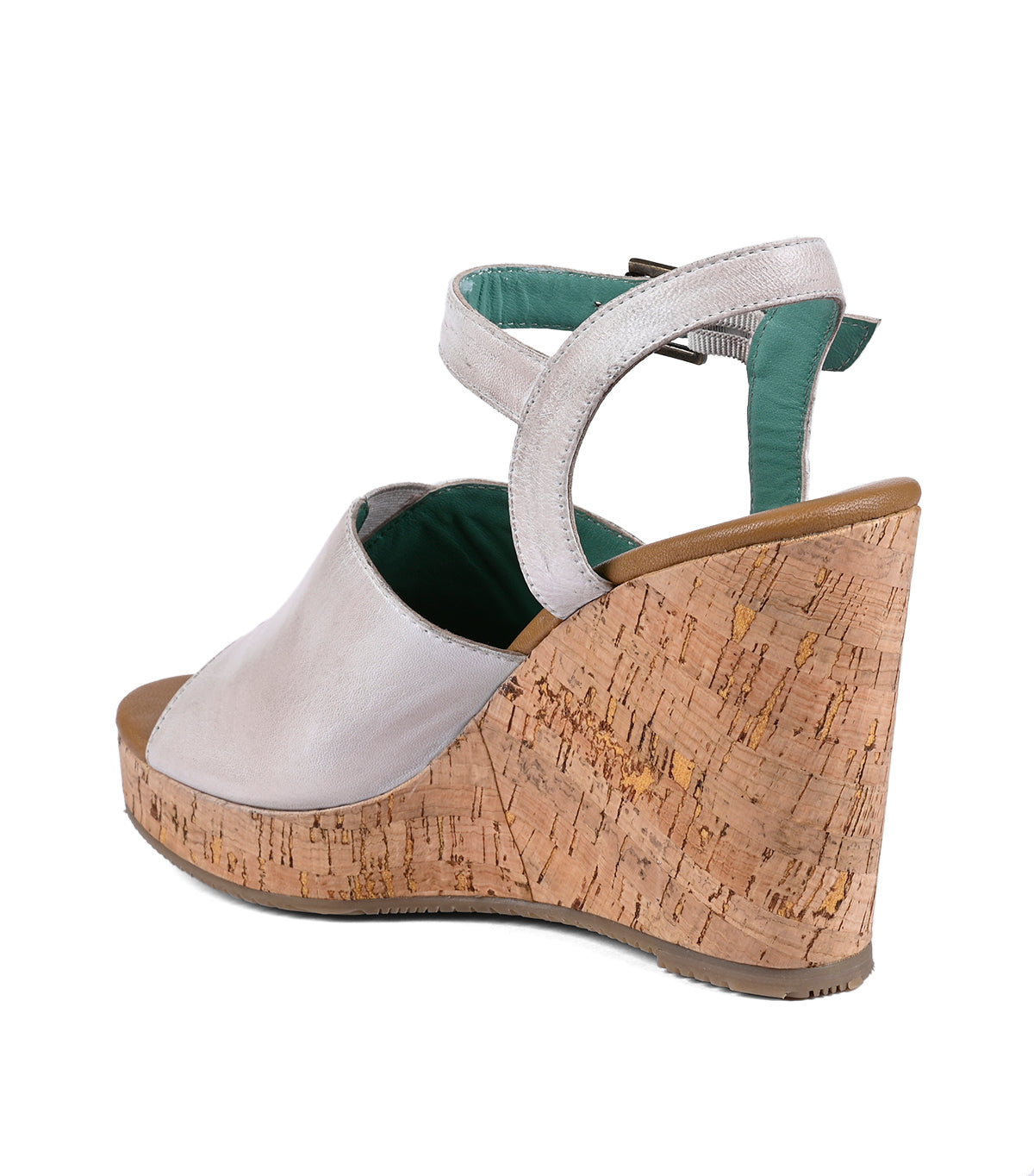 
                  
                    A women's beige and silver Deduction wedge heels sandal with a cork heel and a green interior, isolated on a white background.
                  
                