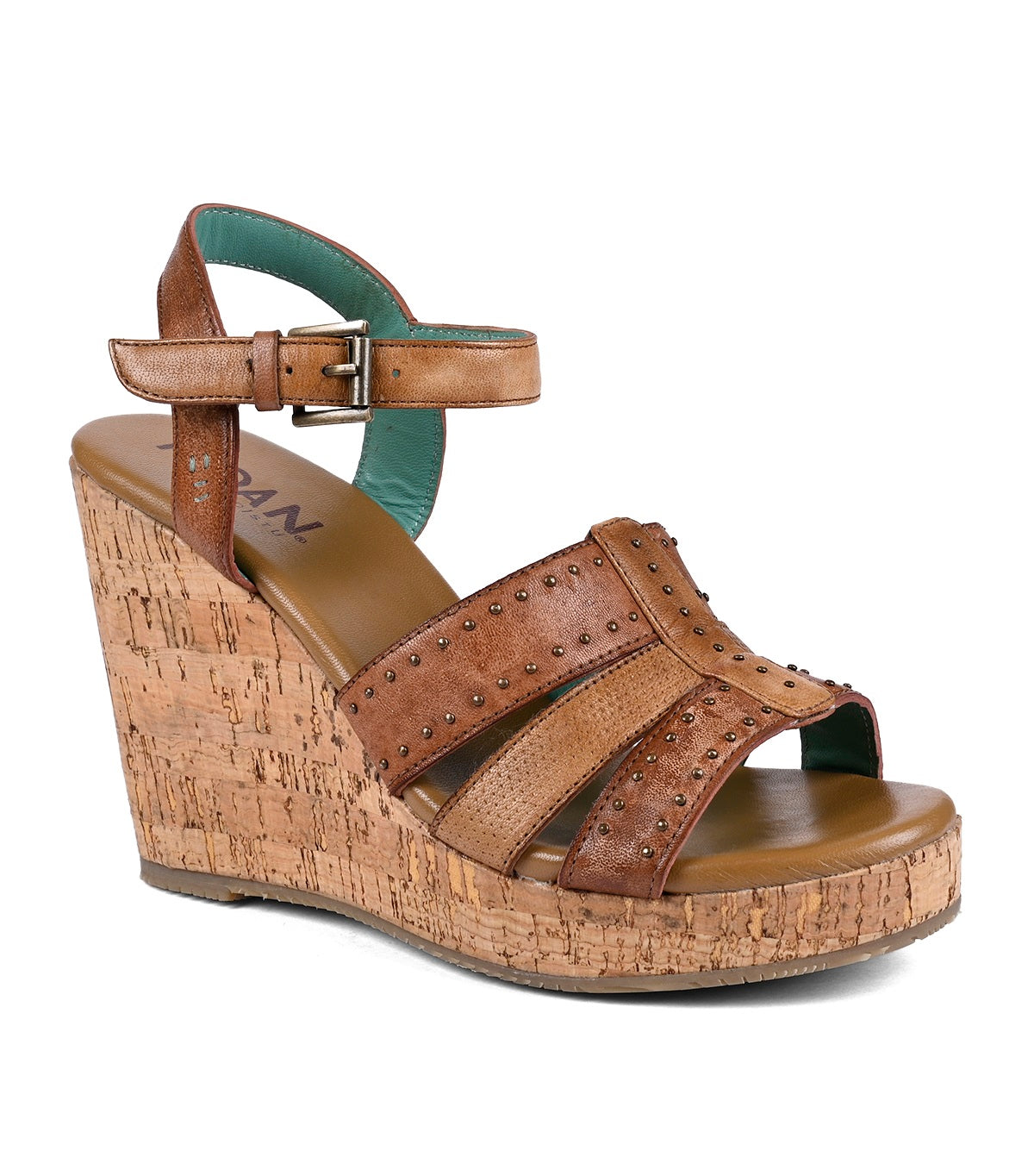 
                  
                    A brown full-grain leather wedge sandal with cork heel, embellished with studs, featuring an ankle strap and open toe design by Roan Different.
                  
                