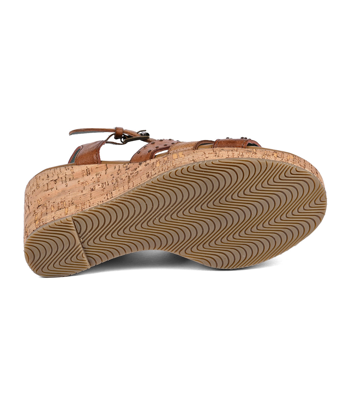 
                  
                    A side view of a Roan Different brown full-grain leather shoe featuring a cork midsole and a wavy-patterned rubber outsole, isolated on a white background.
                  
                