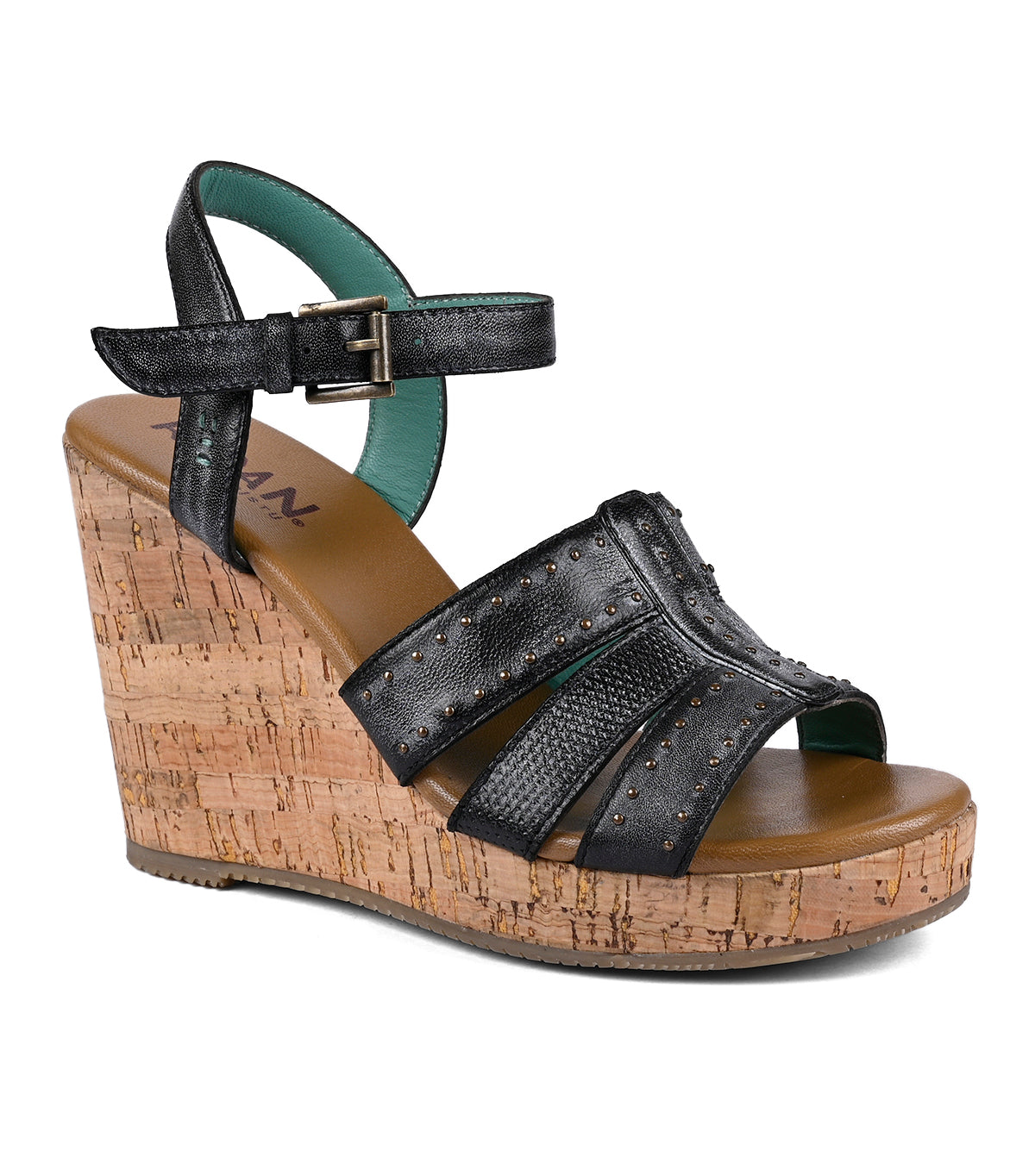 Roan Different black platform wedge sandal with cork heel, featuring studded straps and a buckle closure, isolated on a white background.