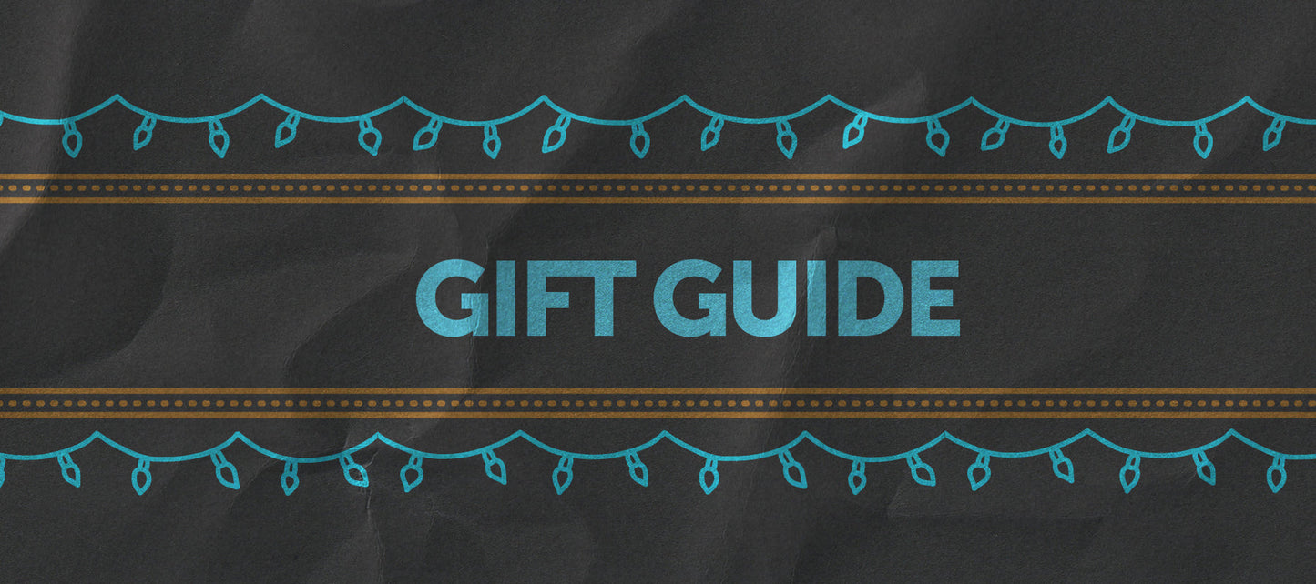 A beige background with blue ornaments hanging above a blue-outlined rectangle containing the words "GIFT GUIDE" in bold, capital letters.
