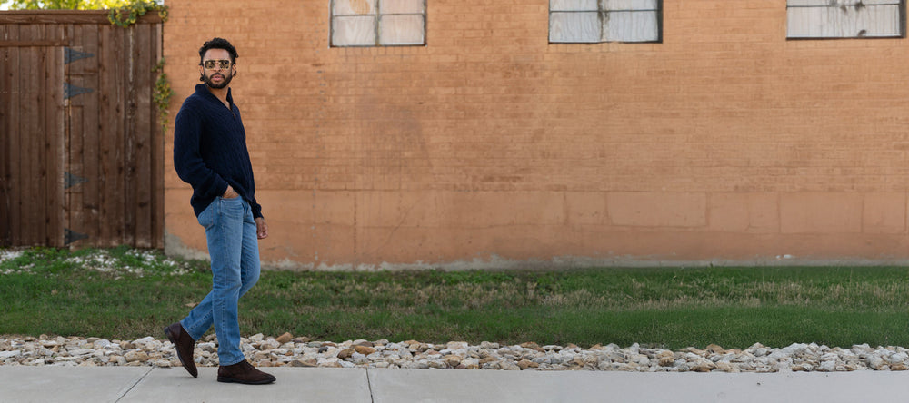 A man leaning against a wall.