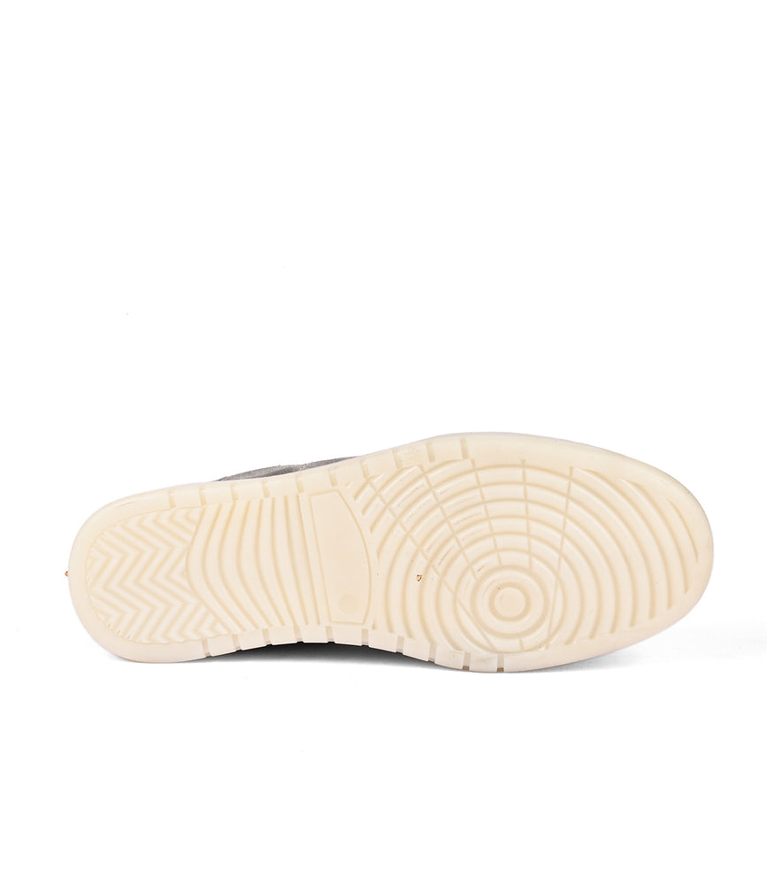 
                  
                    The Roan Attitude rubber outsole of a shoe against a white background.
                  
                