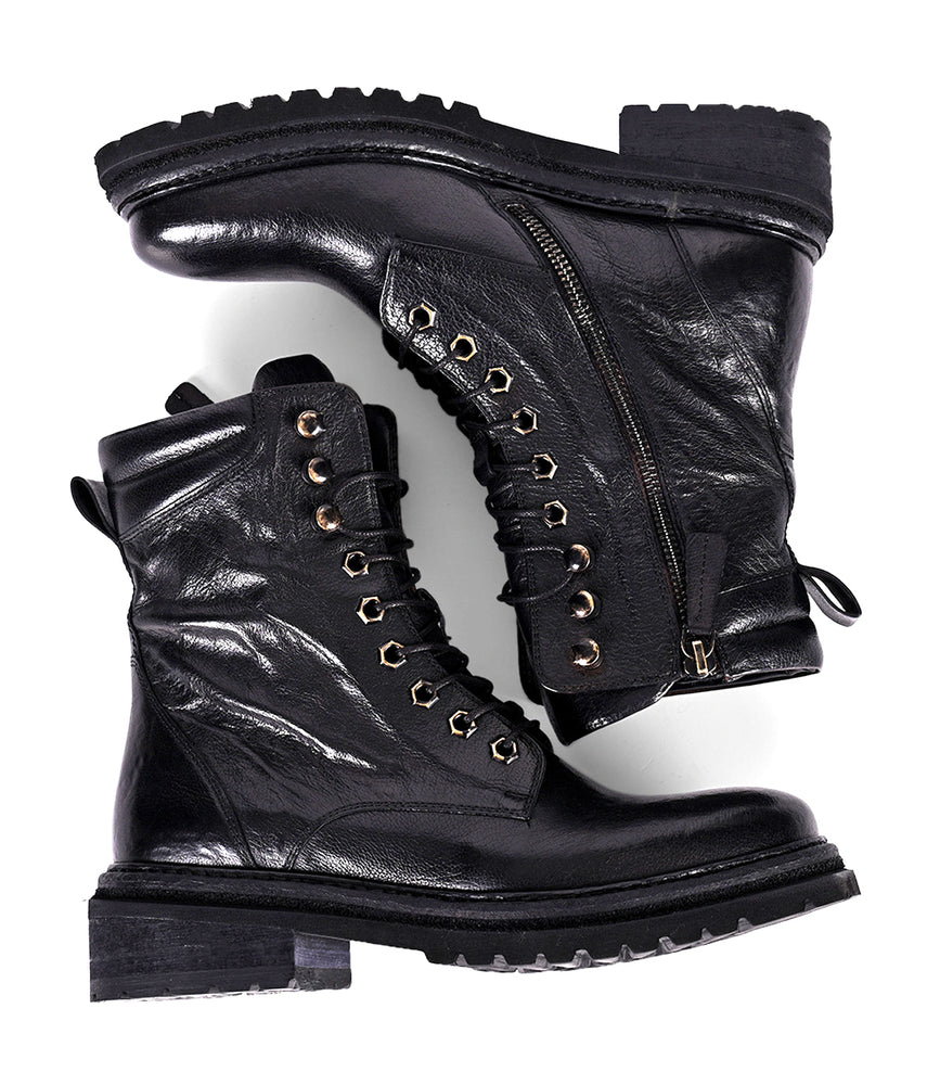 
                  
                    Two women's black leather hiker boots side by side
                  
                