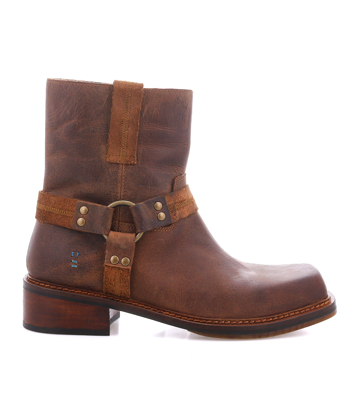 
                  
                    The Roan Bonsai features a brown full-grain leather ankle boot design with a low heel, metal ring harness strap detail, and decorative straps, displayed in side profile on a white background—perfectly capturing the moto boots aesthetic.
                  
                