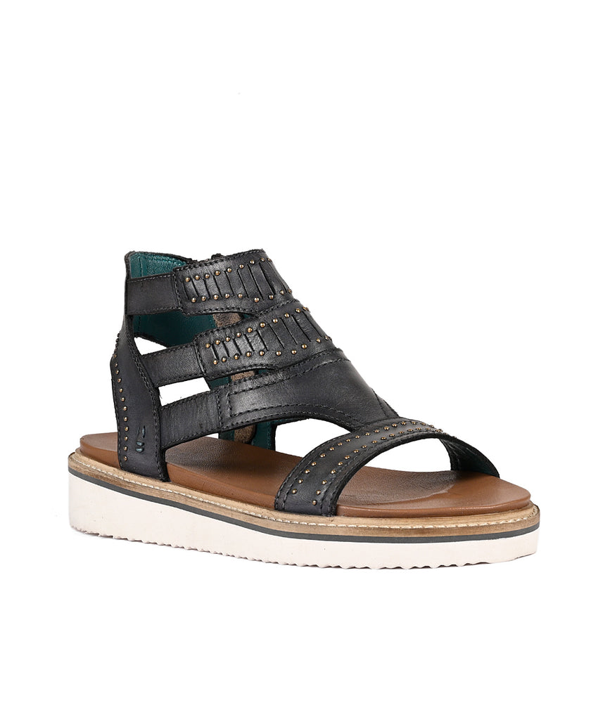 
                  
                    Black studded women's sandal featuring a lightweight platform outsole with a chunky sole on a white background.
                  
                