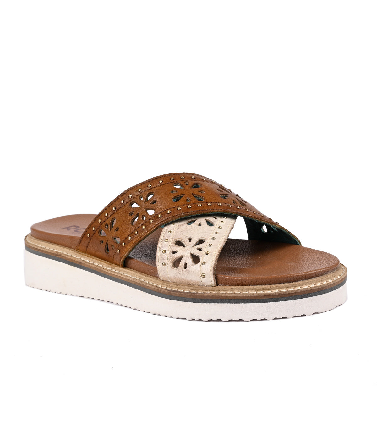 Brown women's lightweight slide-on sandal with cut-out designs on a white background by Roan Chant.