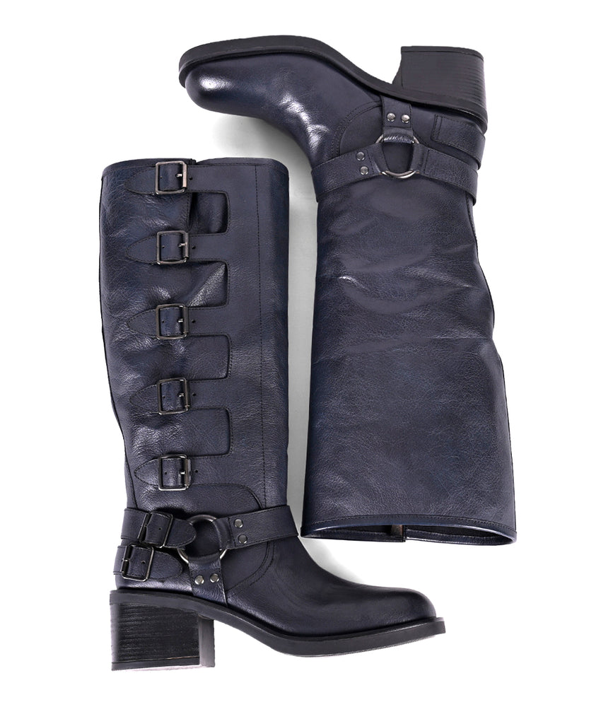 
                  
                    Women's tall black leather boots with side buckles, laid side by side
                  
                