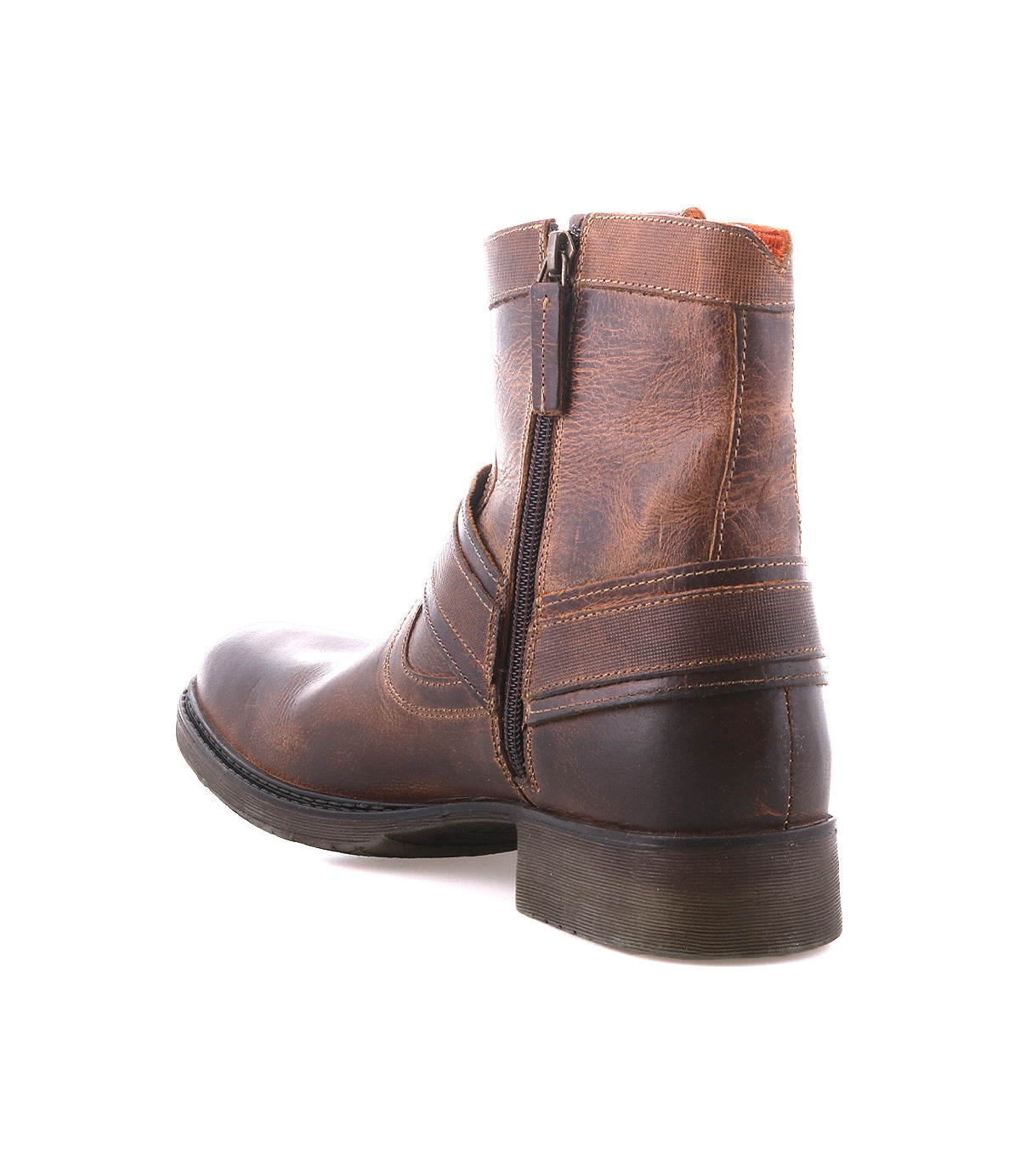 
                  
                    The Roan Colton II is a brown leather ankle boot with a side zipper, visible stitching, low heel, and subtle perforation detail, shown against a white background.
                  
                