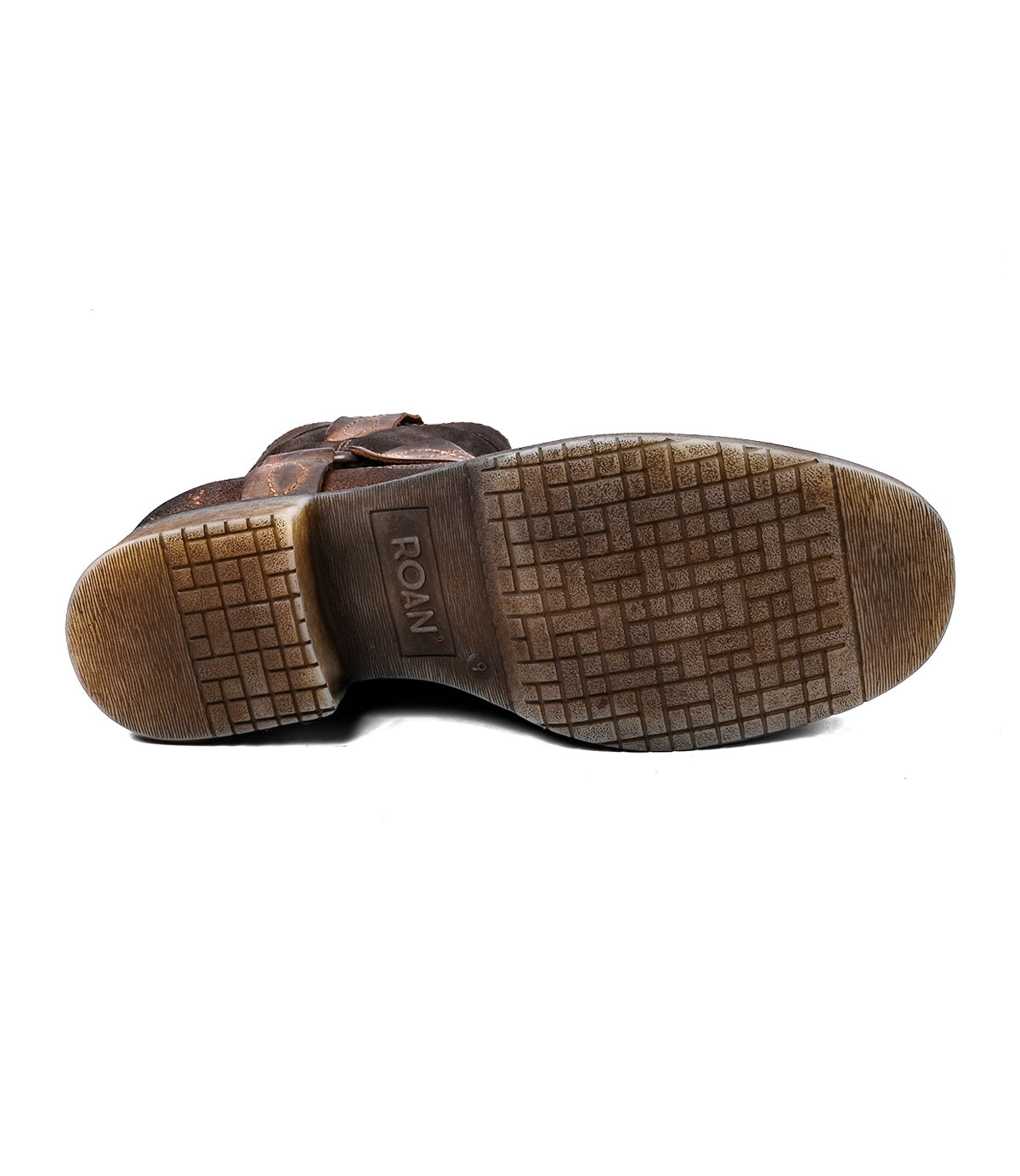 
                  
                    The image shows the bottom view of a worn brown Colton V harness strap boot by Roan, featuring a textured rubber sole with "ROAN" embossed in the center.
                  
                