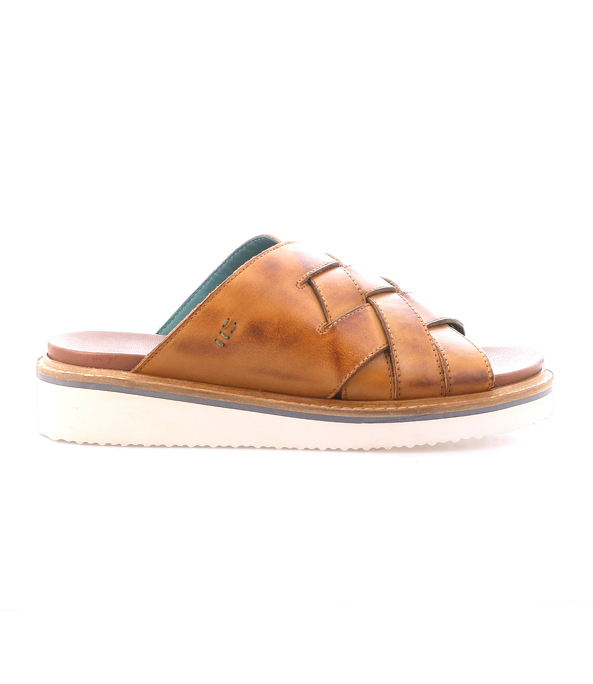The Roan Cottage is a brown leather slide sandal with cushioned crisscross straps, open toe, and a white flexible foam outsole, shown in profile on a plain white background.