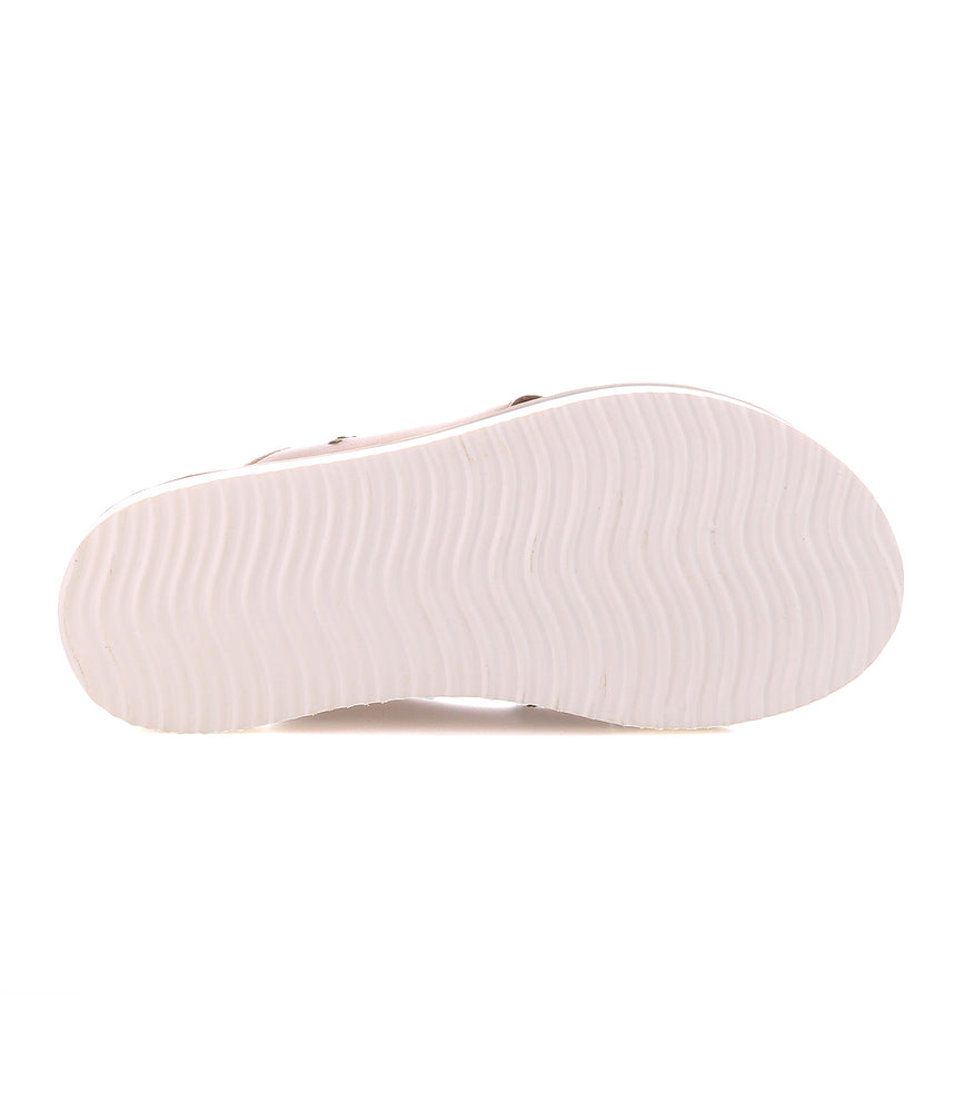
                  
                    Bottom view of the Roan Cottage shoe sole, featuring a wavy tread pattern and flexible foam outsole, shown against a white background.
                  
                