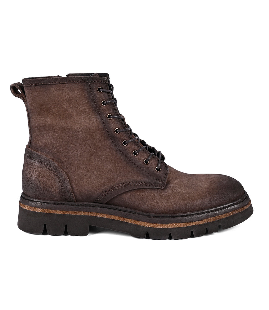 The Roan Duty boot, crafted from brown leather and featuring a side zipper and thick black sole, showcases a padded insole for enhanced comfort when viewed from the side.