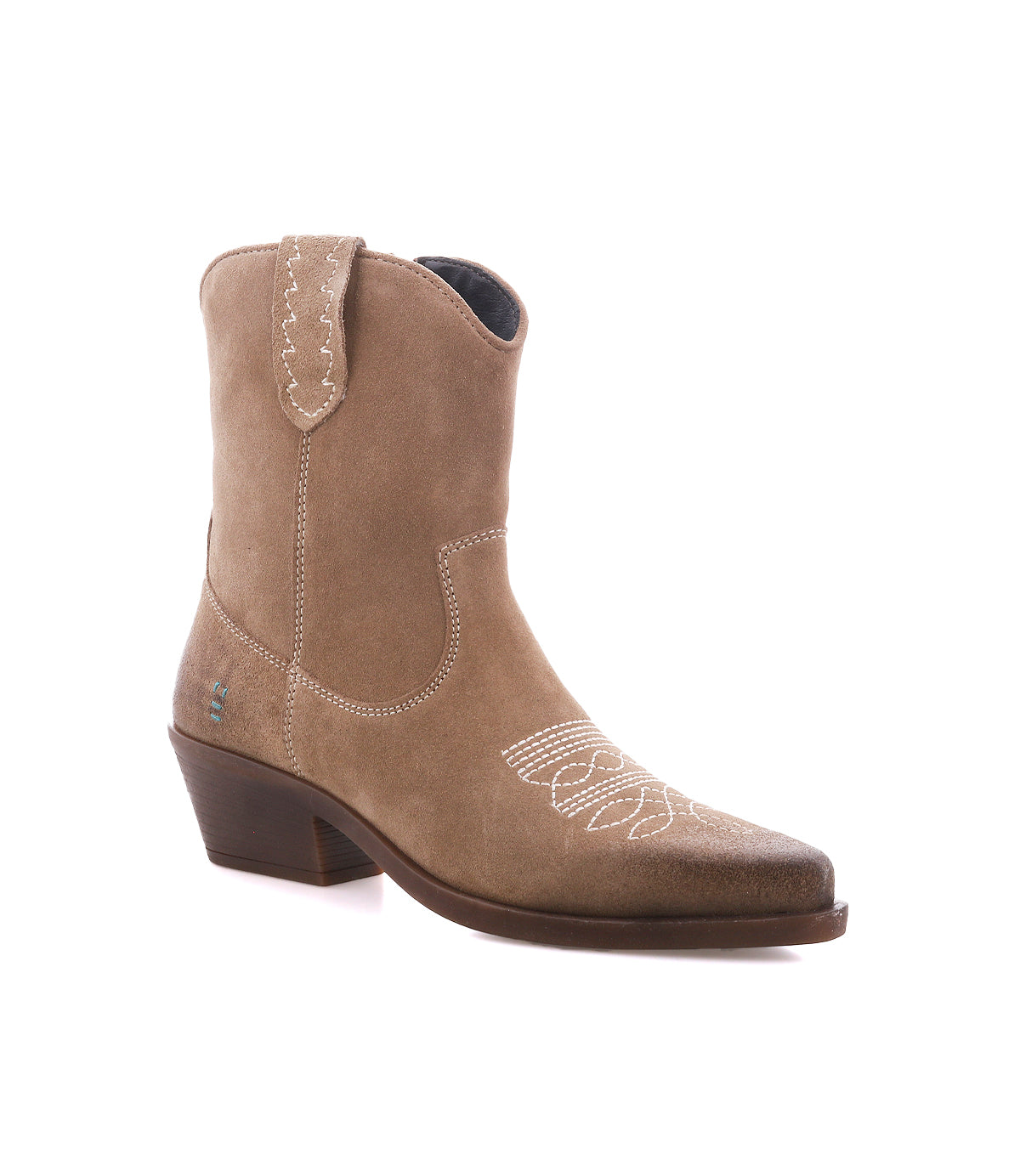 
                  
                    The ‘Discussion’ cowboy boot by Roan features soft tan suede with white stitching, a short stacked heel, convenient pull tabs, and a pointed toe—shown against a white background and ideal for infusing any outfit with genuine western flair.
                  
                