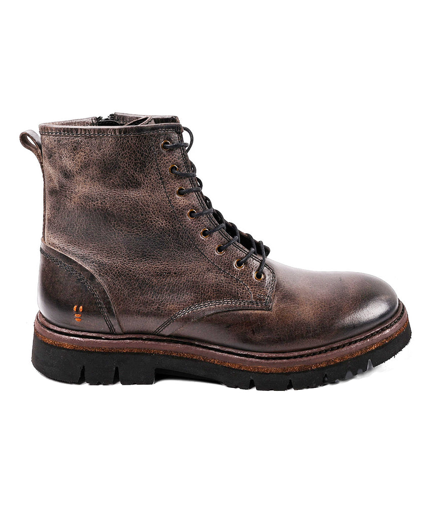 
                  
                    The Roan Duty boot features brown leather with a textured finish, black rubber sole, visible stitching, lace-up front, and side zipper. Displayed in profile against a white background.
                  
                