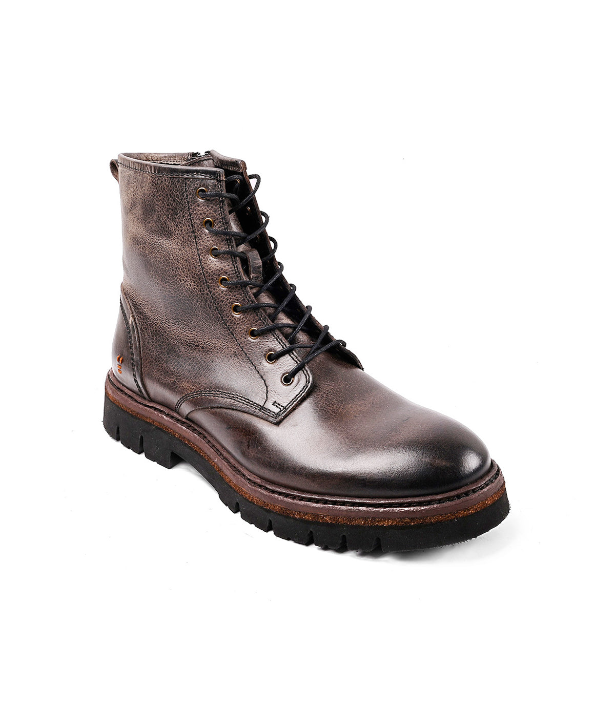 
                  
                    The Roan Duty is a single brown leather lace-up boot with a rugged rubber sole and side zipper, shown against a white background.
                  
                