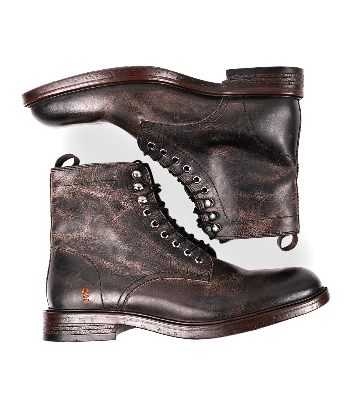 
                  
                    A pair of Roan Duty men's boots in dark brown, showing visible stitching and a worn texture with padded insoles, are displayed side by side against a white background.
                  
                