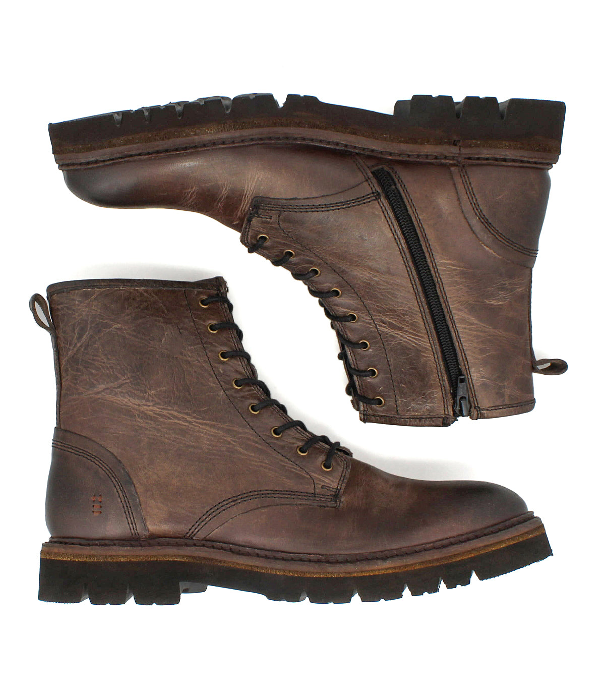 
                  
                    Roan Duty boots: a pair of brown leather lace-up boots with rugged soles and padded insoles; one boot features a partially open side zipper.
                  
                
