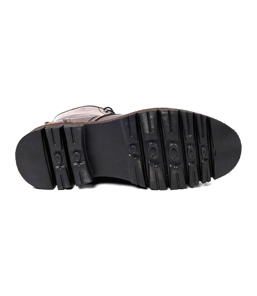 
                  
                    Bottom view of the Roan Duty suede boot with a black rubber sole featuring patterned treads for grip and traction, plus a side zipper for easy wear, shown against a white background.
                  
                