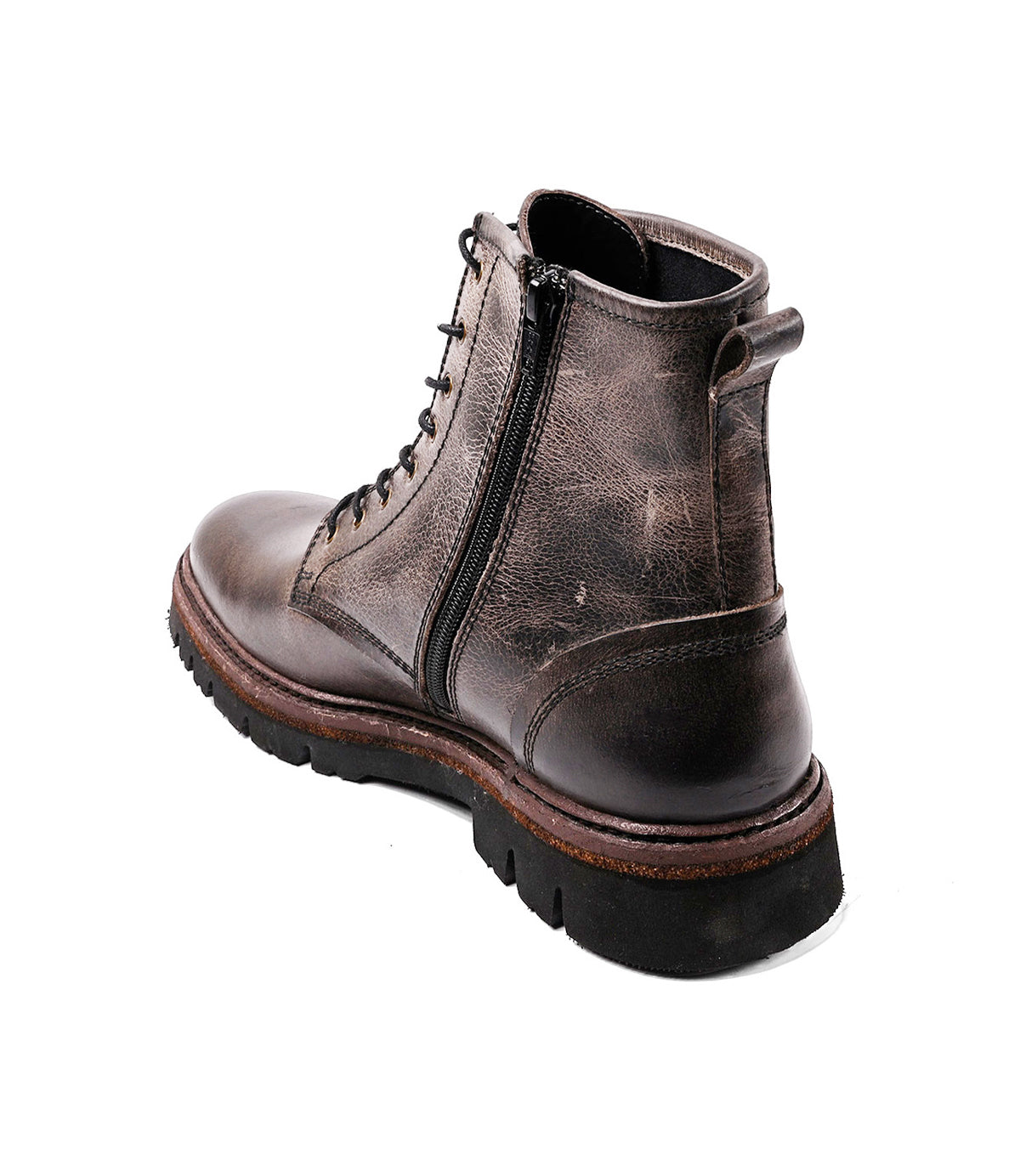 
                  
                    The Roan Duty boot is a brown leather lace-up with a padded insole, side zipper, worn texture, and thick black rubber sole, shown against a white background.
                  
                