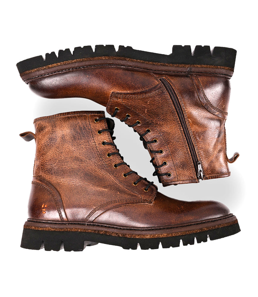 
                  
                    The Roan Duty boots are brown leather lace-ups with rugged black soles, padded insoles, and a side zipper on one boot, shown against a white background.
                  
                