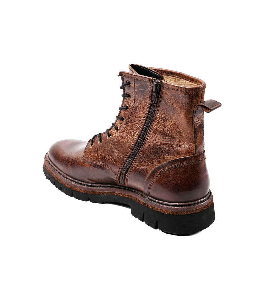 
                  
                    The Roan Duty men's boot features brown leather, a padded insole, lace-up front, side zipper, and black rubber sole, shown angled to display the outer side and back.
                  
                