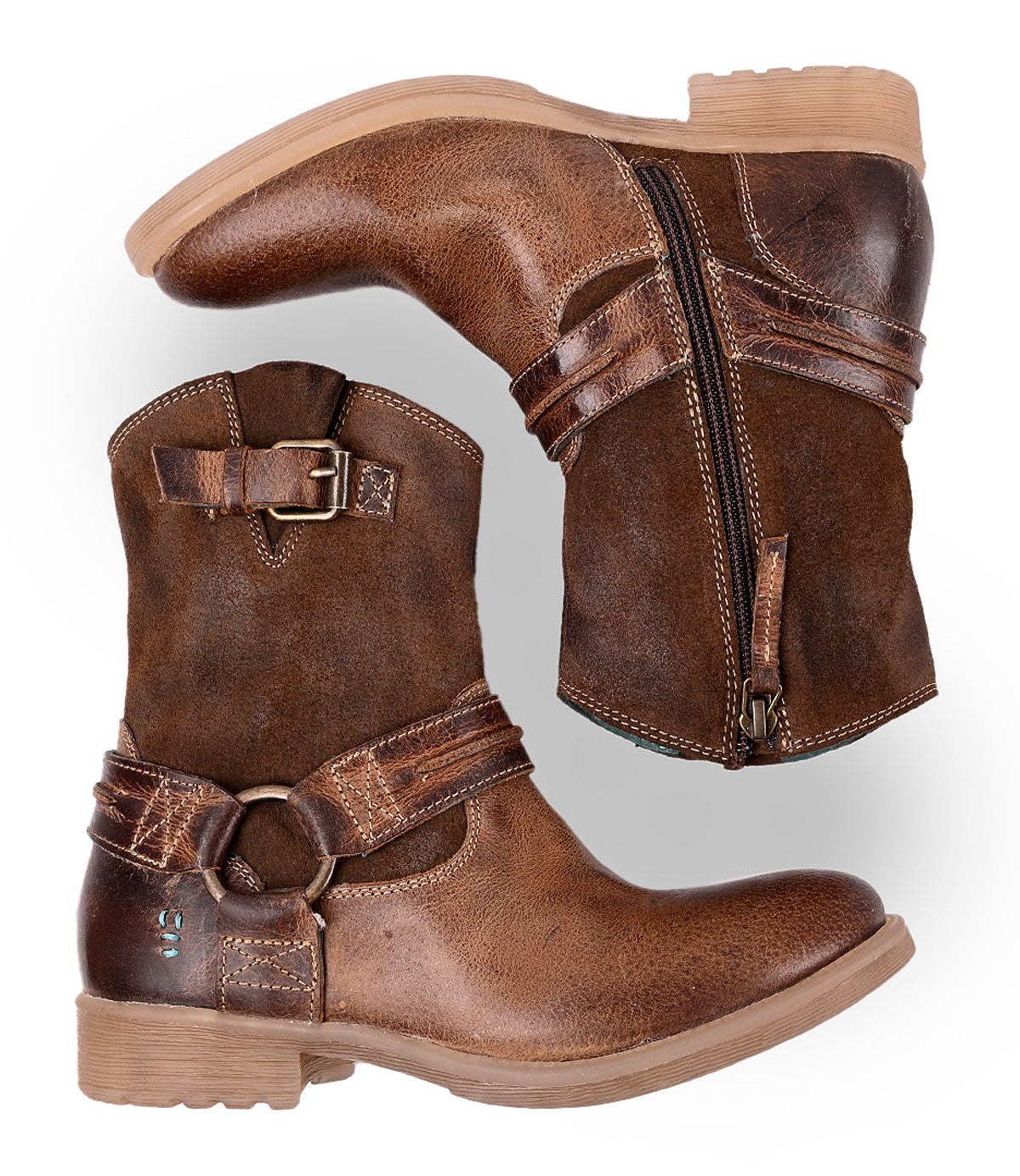 
                  
                    A pair of Roan Flair brown leather ankle boots with buckles, Western stitching, and side zippers are displayed side by side on a white background.
                  
                
