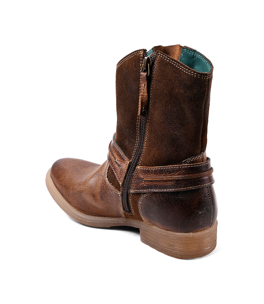 
                  
                    The Roan Flair is a brown mid-calf leather boot featuring a low heel, side zipper, decorative straps, and Western stitching, displayed on a white background.
                  
                