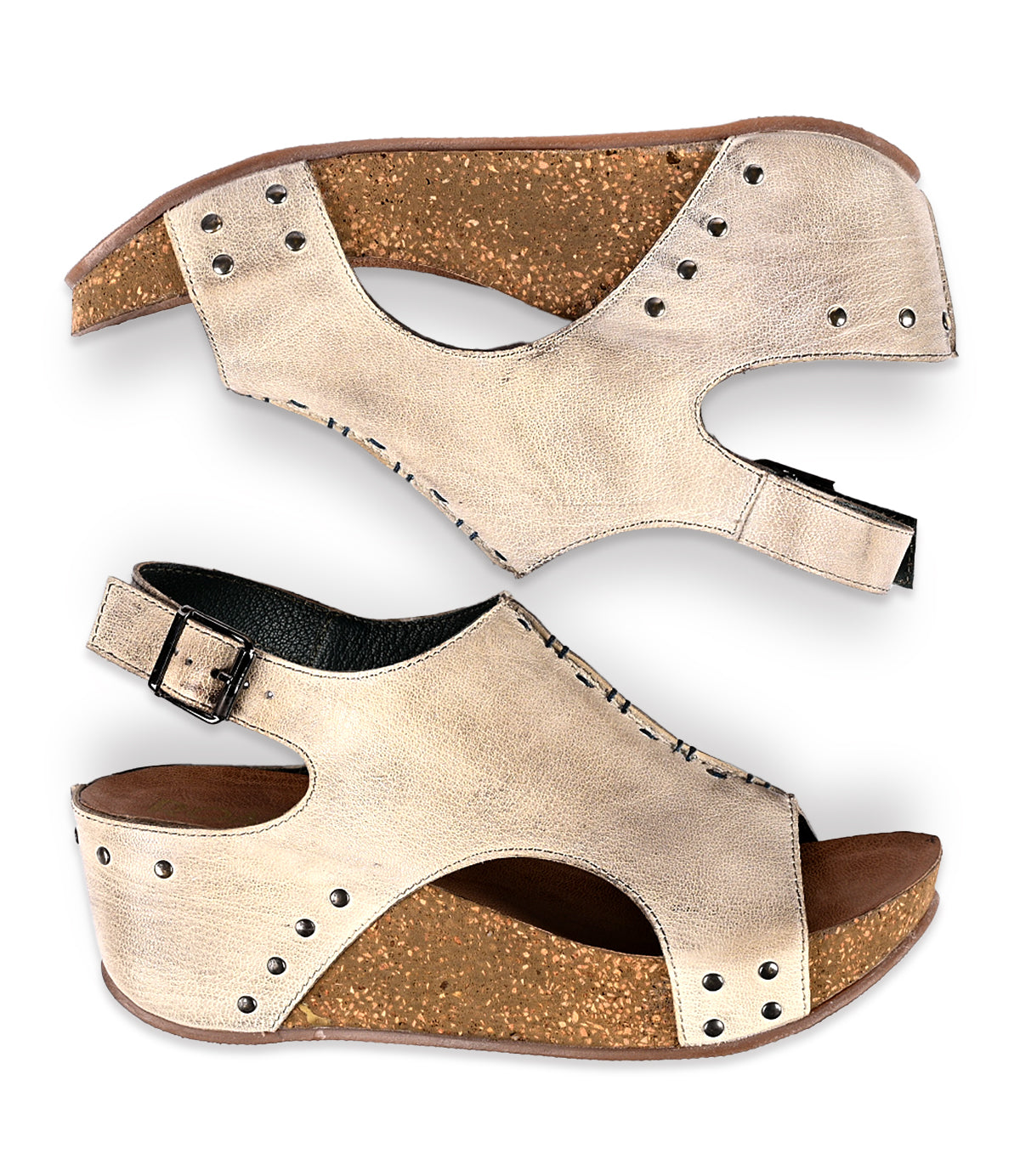 
                  
                    A pair of beige full-grain leather women's sandals with buckles and stud details, isolated on a white background from Roan's Fortnight collection.
                  
                
