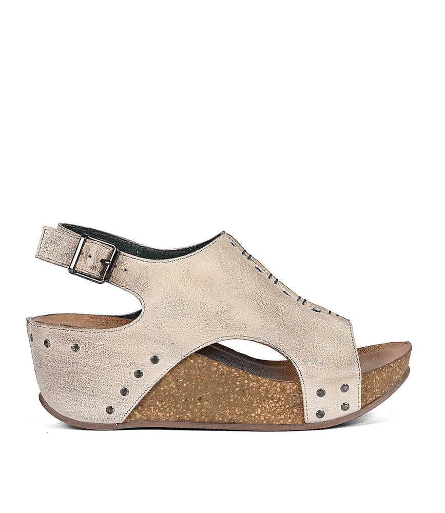 Fortnight women's sandal with a cork wedge heel, peep-toe design, and slip-on shoe style, isolated on a white background by Roan.