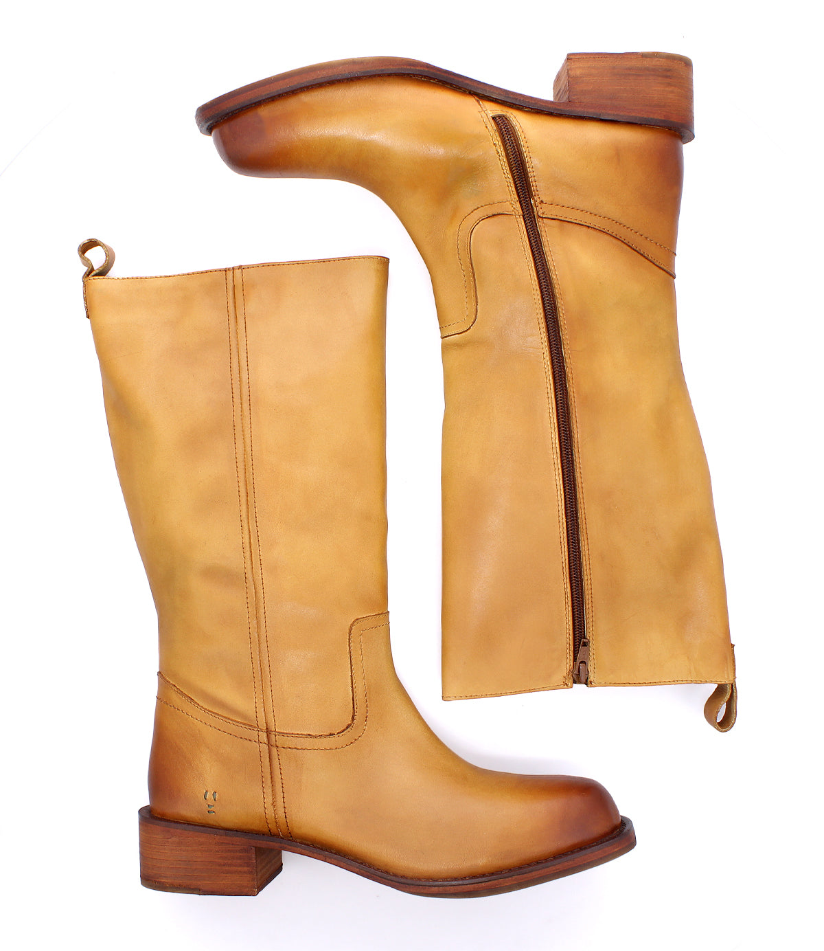 
                  
                    Pair of Roan Froe tan full-grain leather mid-calf boots with a low heel; one boot, inspired by classic Western styles, is shown with a side zipper partially unzipped and displayed on a white background.
                  
                