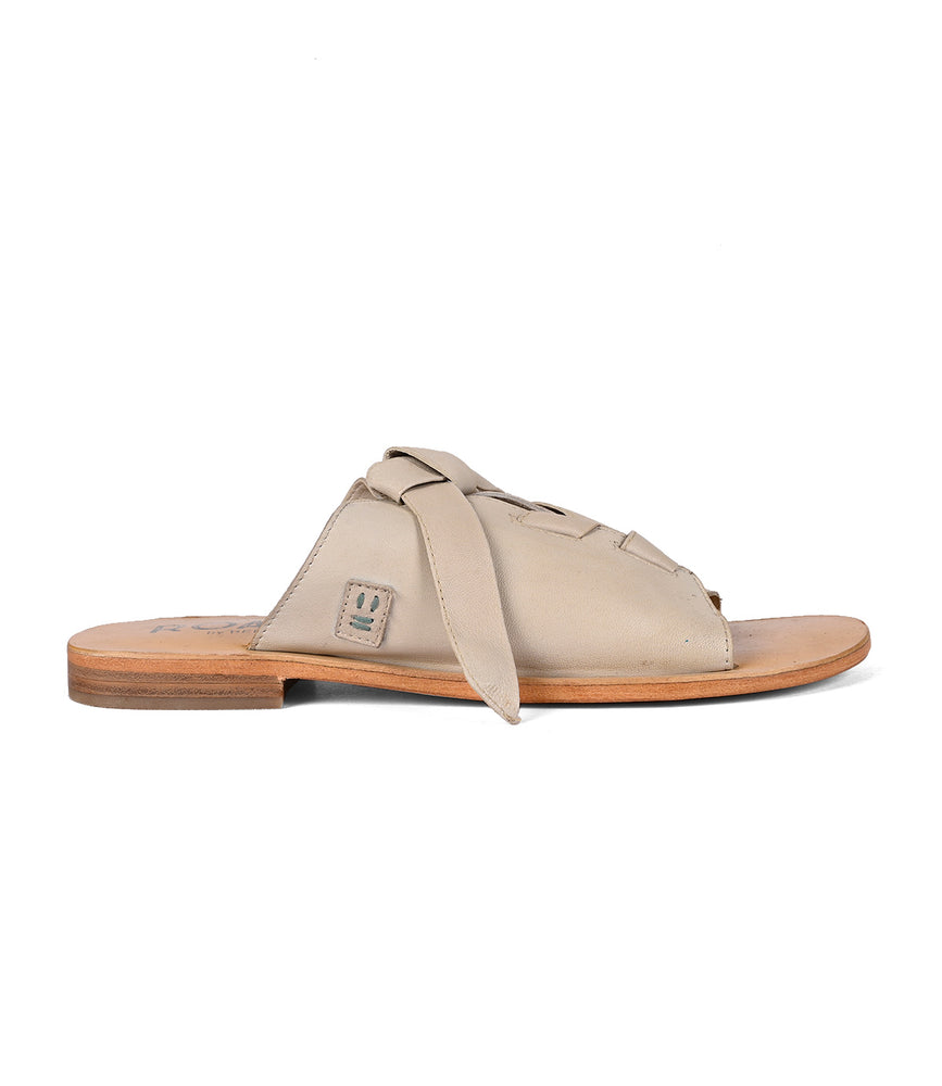 
                  
                    Roan Grapevine sandal with adjustable leather straps on a white background.
                  
                