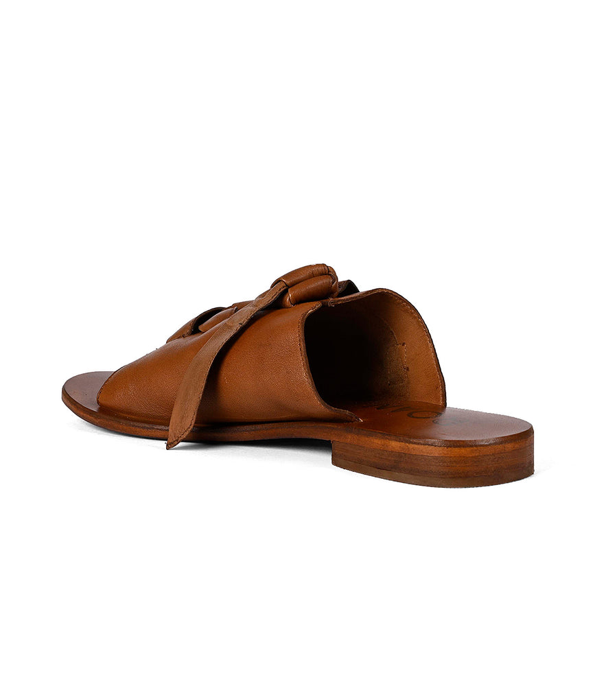 
                  
                    A single Grapevine sandal with adjustable Roan leather straps displayed against a white background.
                  
                