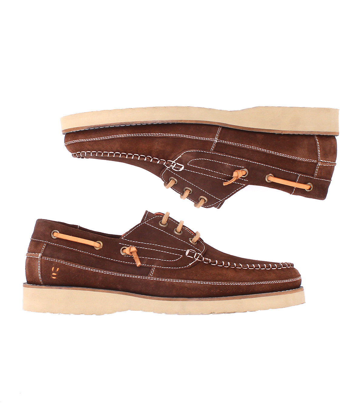 
                  
                    The Roan Glory is a pair of brown suede boat shoes with tan laces, beige stitching, cream rubber soles, and a cushioned footbed, shown from the side.
                  
                
