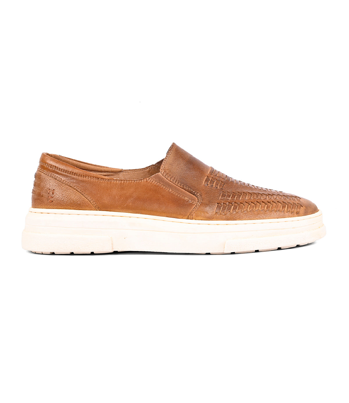 
                  
                    The Gregor by Roan is a brown handwoven goat leather slip-on shoe with woven detailing and a thick white rubber sole, shown in side view on a plain white background.
                  
                