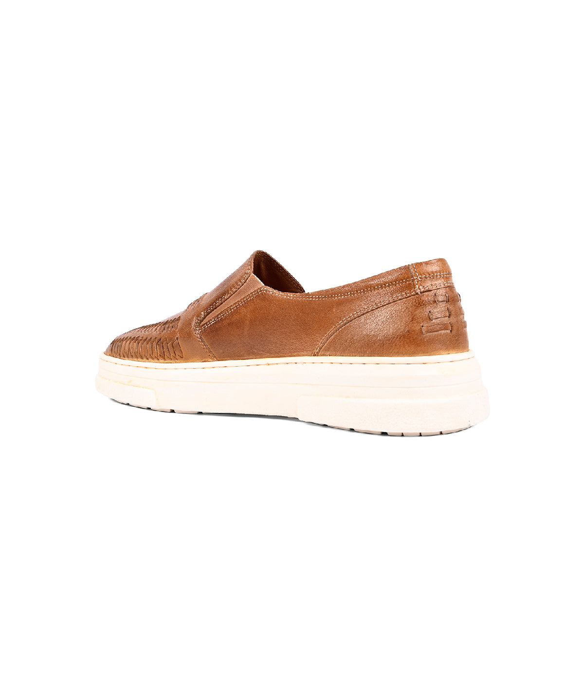 
                  
                    The Gregor by Roan is a brown handwoven goat leather slip-on shoe with a white rubber sole, woven side detailing, and heel stitching, displayed at a rear side angle on a white background.
                  
                