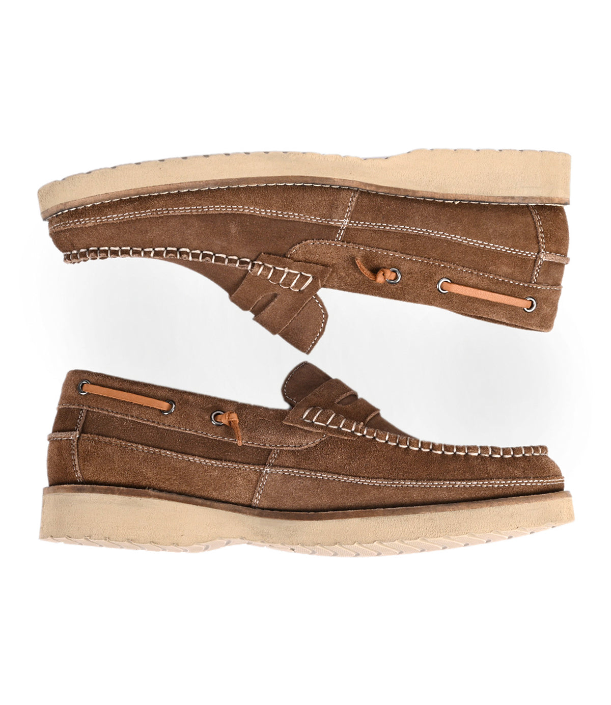 
                  
                    The Roan Grid is a brown suede penny loafer with beige soles, white stitching, and a cushioned insole for comfort, shown from the side on a white background.
                  
                
