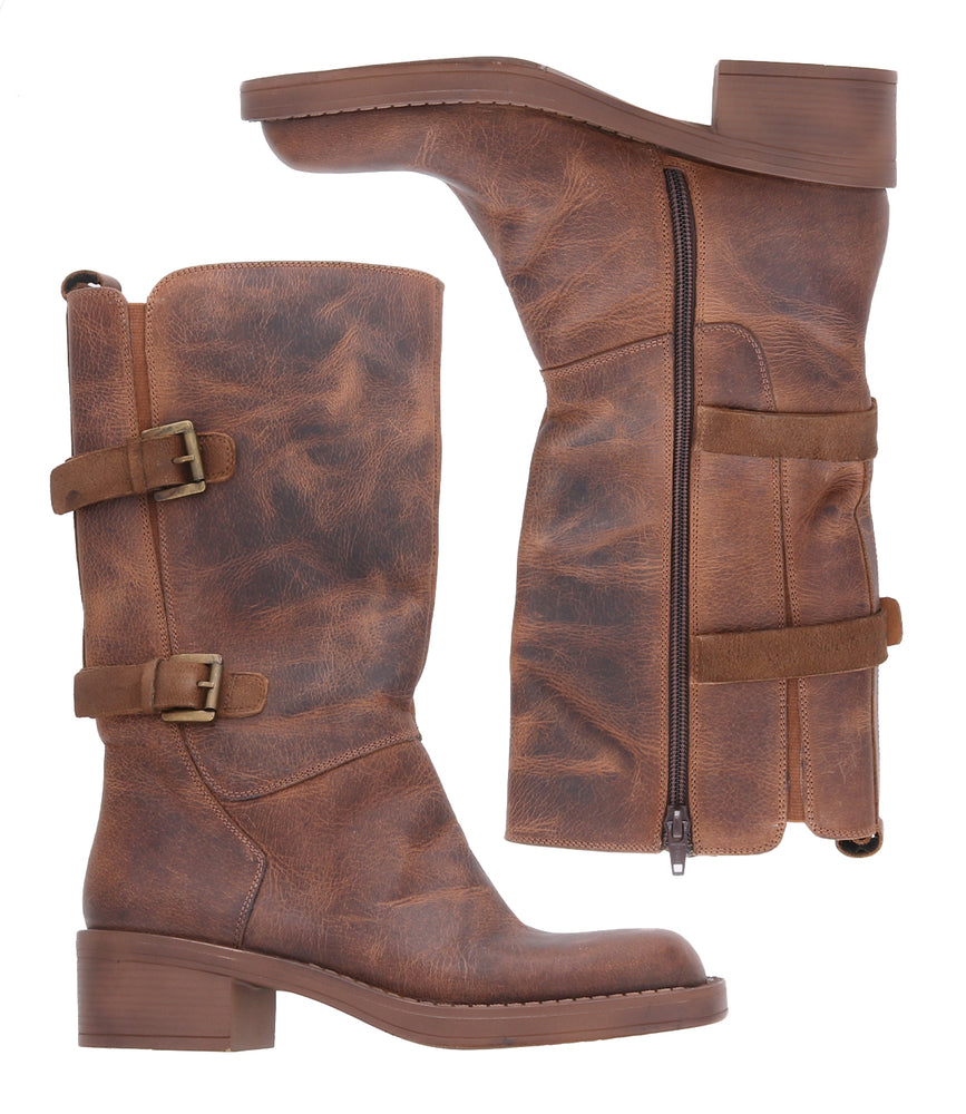 
                  
                    The Roan Iceberg boots are brown mid-calf moto-inspired footwear made of distressed leather with side buckles, a zipper, and a low block heel, shown from both the side and interior views.
                  
                