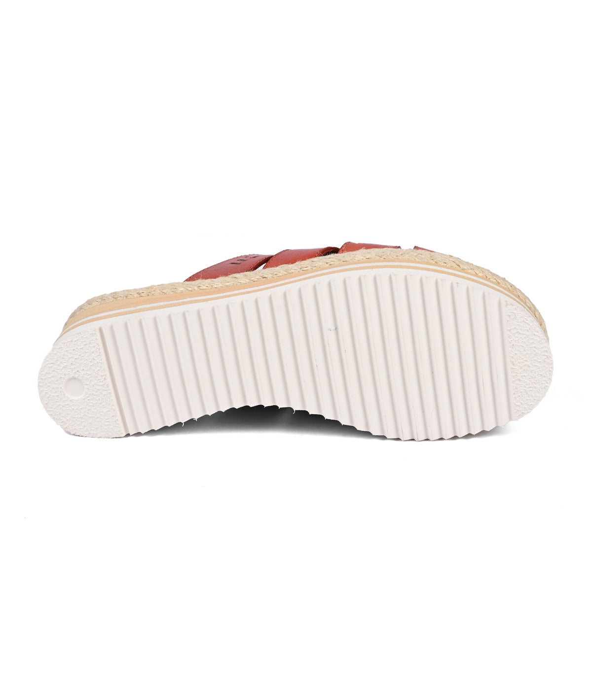 
                  
                    The image showcases the Incant platform slide sandal by Roan, featuring a white, ridged sole with a circular heel pattern that enhances its boho-chic charm.
                  
                