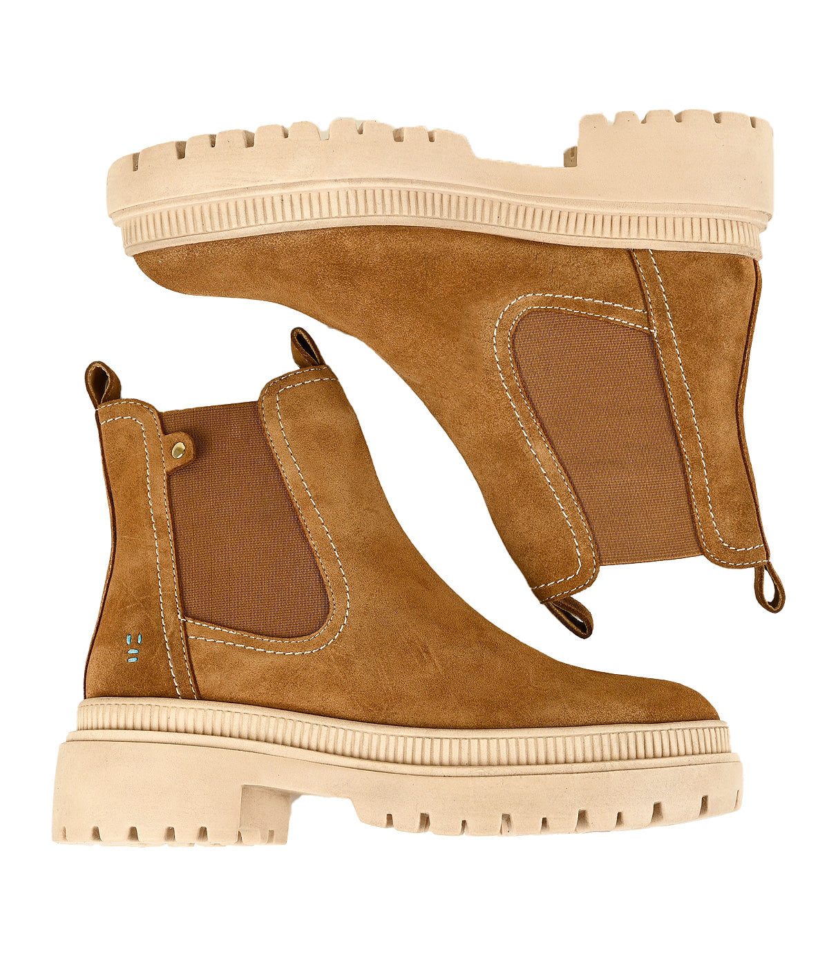 
                  
                    Step into style with the Indwelt Chelsea boots by Roan—a tan suede pair featuring chunky beige platform soles, white stitching, and elastic side panels for effortless slip-on comfort, showcased against a white background.
                  
                