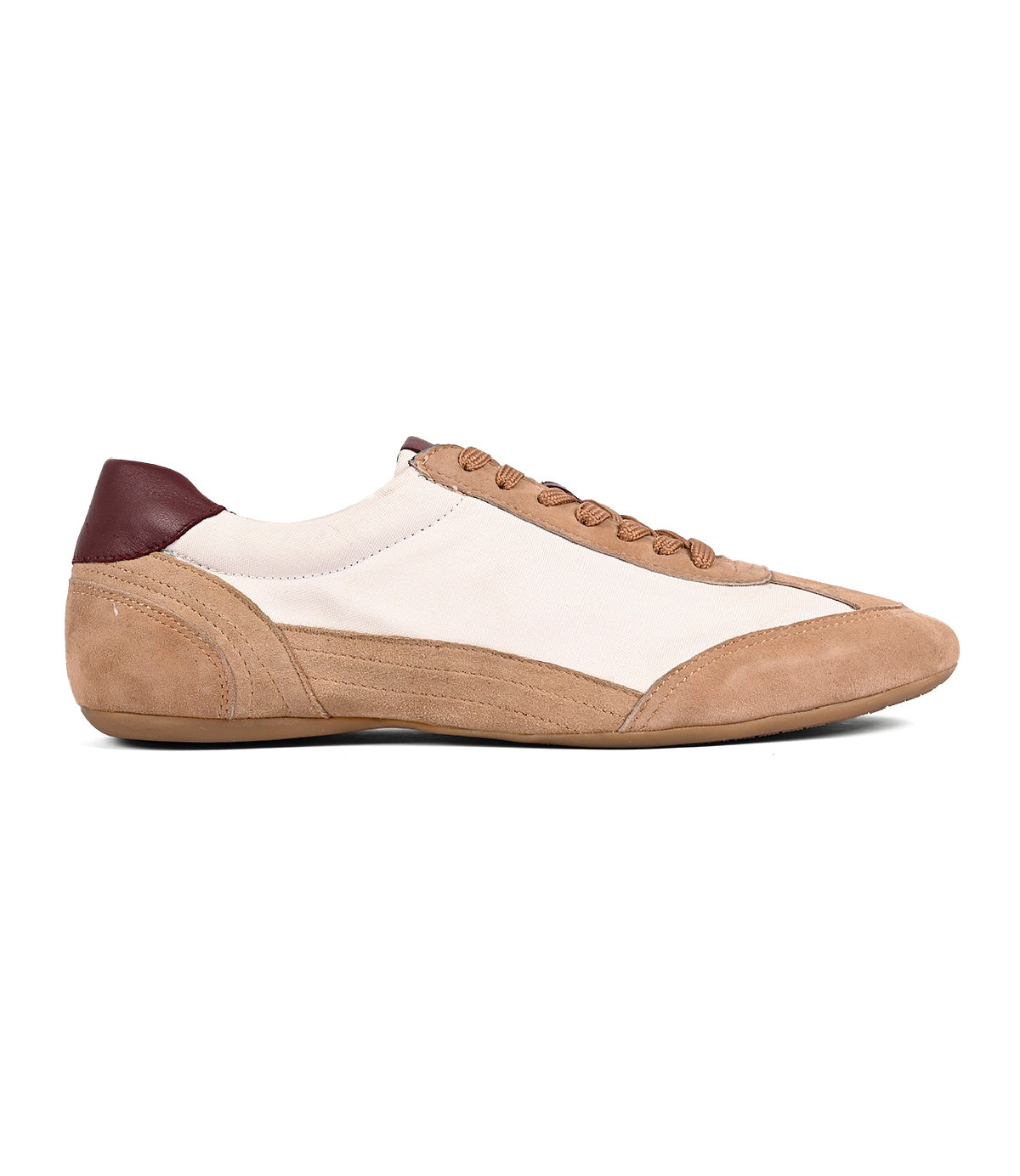 
                  
                    The Roan Keyset is a beige and brown low-profile sneaker with a white fabric upper, tan goat suede accents, and a dark brown heel detail, shown in side profile.
                  
                
