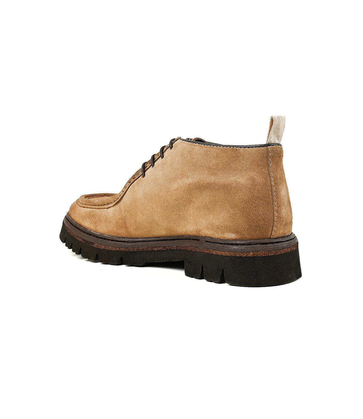 
                  
                    A back-angle view of the Roan Kickoff, a tan suede chukka lace-up shoe featuring a moc-toe design and a thick black sole, set against a white background.
                  
                