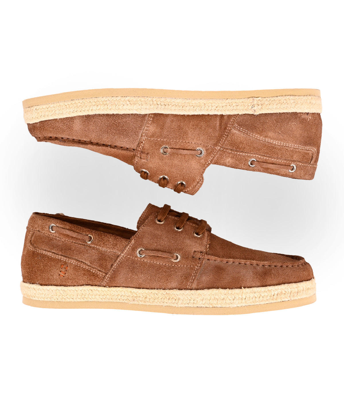 
                  
                    The Roan Knower is a pair of brown washed suede lace-up boat shoes with tan rubber soles, shown from the side—one shoe up, one down. A cushioned footbed ensures all-day comfort and support.
                  
                