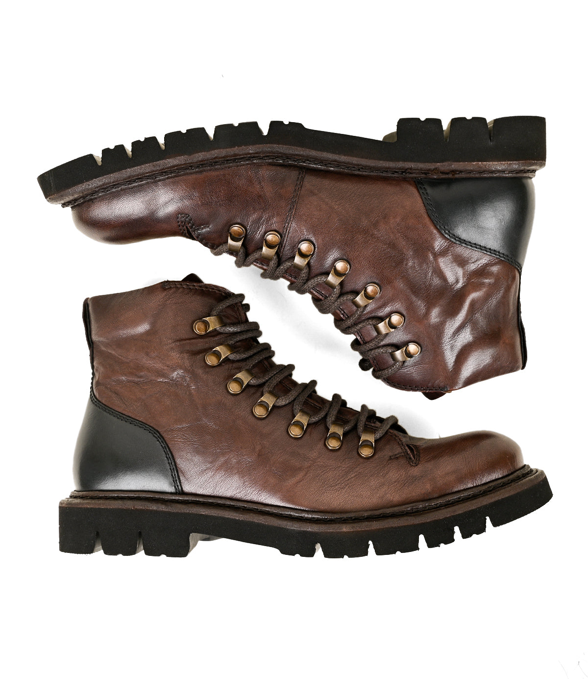 
                  
                    A pair of Roan Main brown Alicante leather lace-up boots with black soles and metallic eyelets, featuring hiker-style laces, placed side by side on a white background.
                  
                