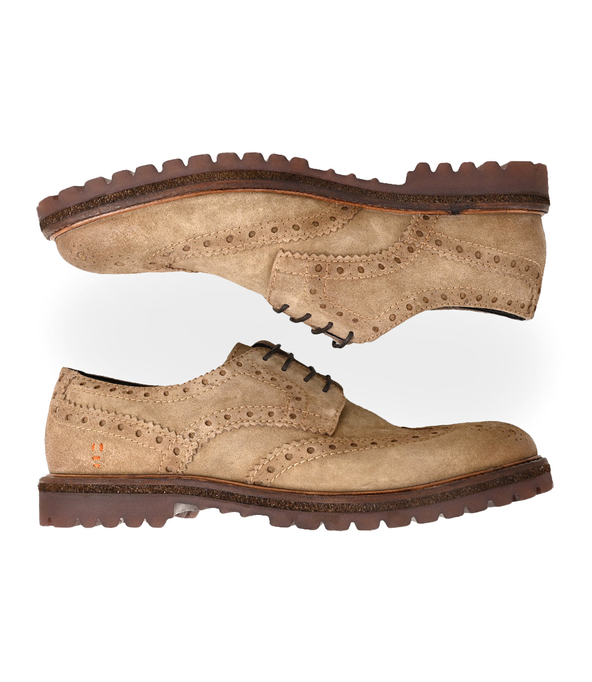
                  
                    A pair of Roan Phiz tan suede wingtip brogue derby men's dress shoes with dark brown chunky lug soles, placed parallel on a white background.
                  
                