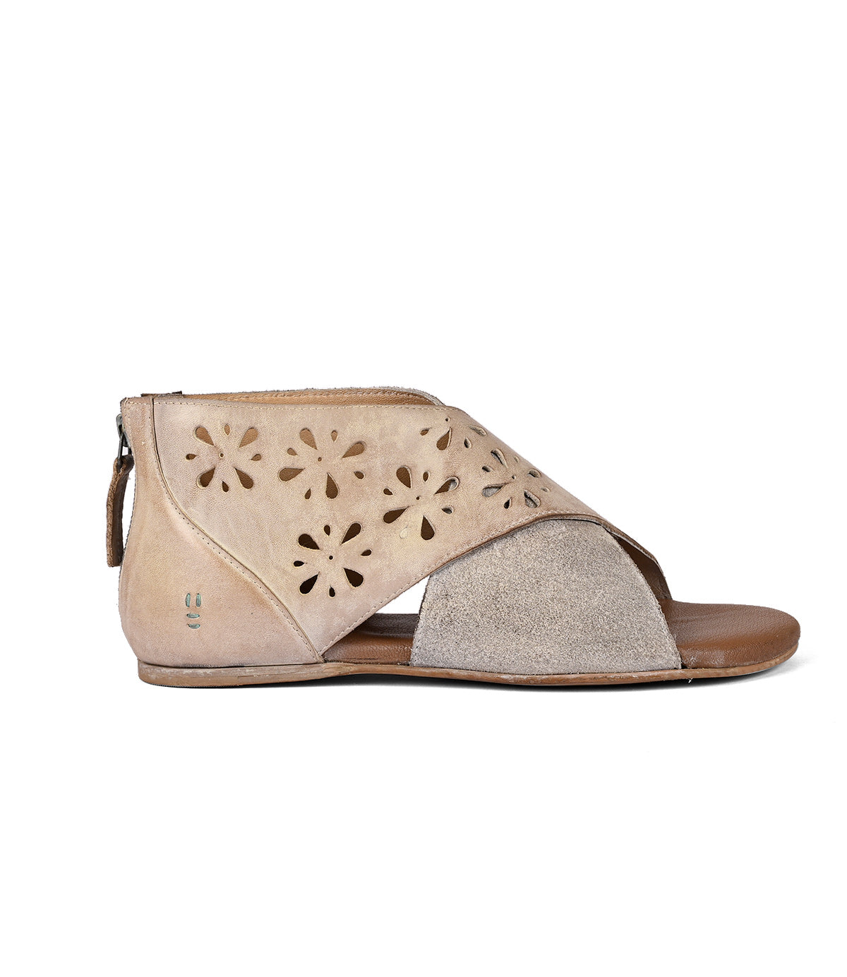 Beige women's flat sandal with laser-cut designs and a zip closure at the heel, displayed against a white background by Roan in the Rotation style.
