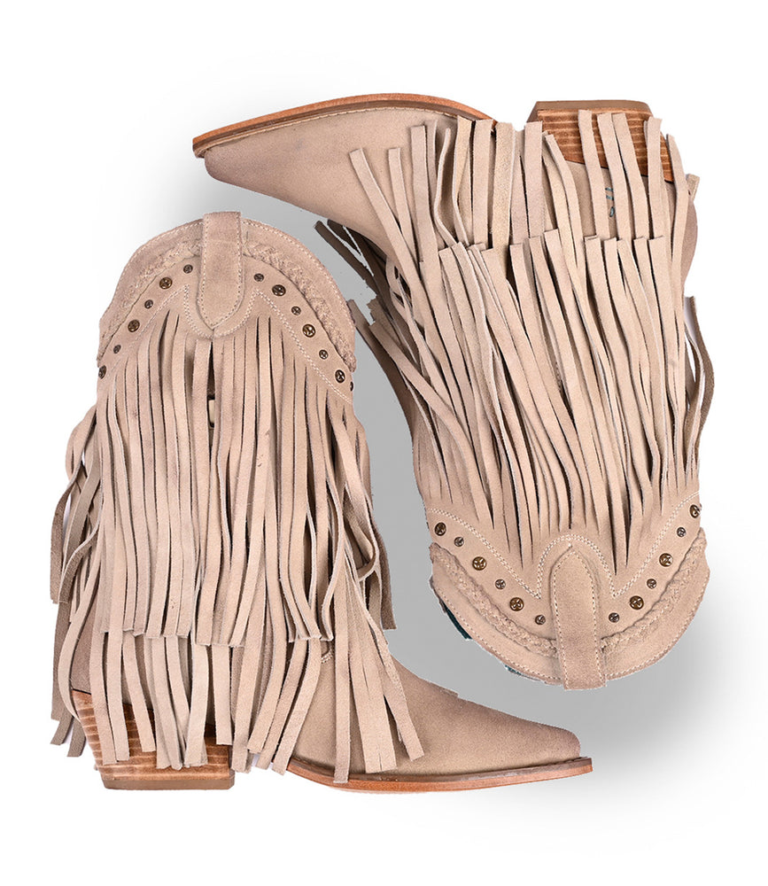 
                  
                    The Setup by Roan are premium suede Western boots featuring fringe detailing, decorative perforations, and stacked wooden heels.
                  
                
