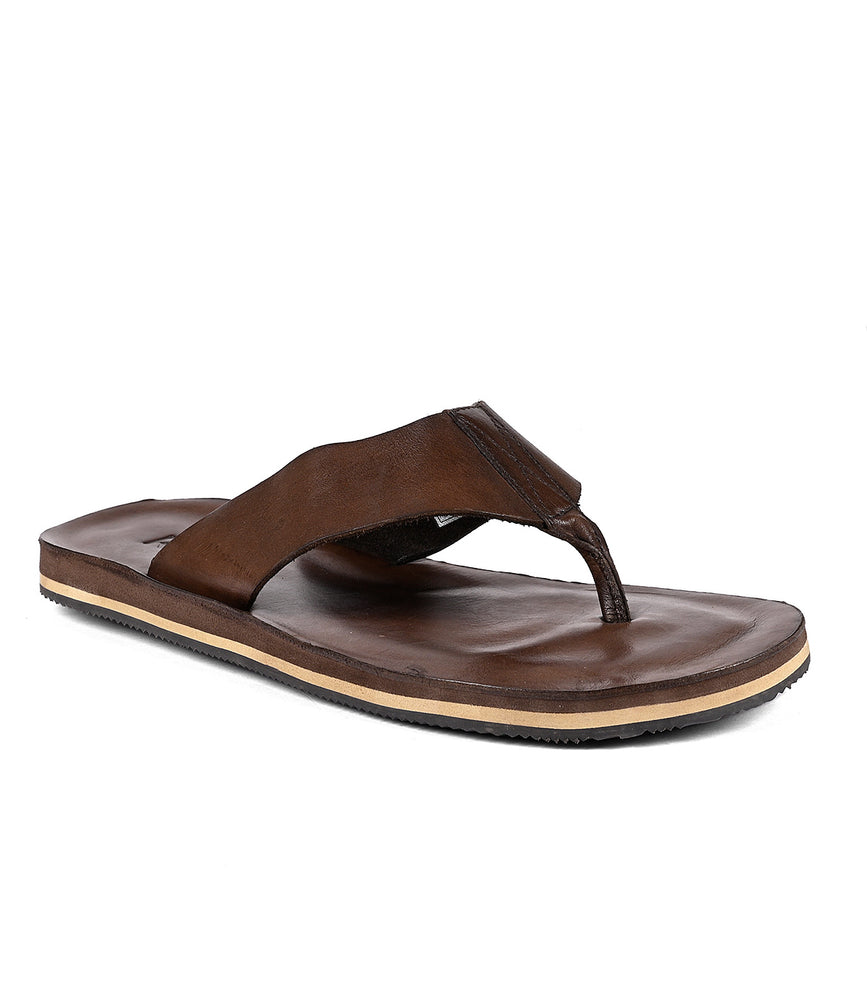 
                  
                    A single Townfolk distressed leather flip-flop sandal on a white background by Roan.
                  
                