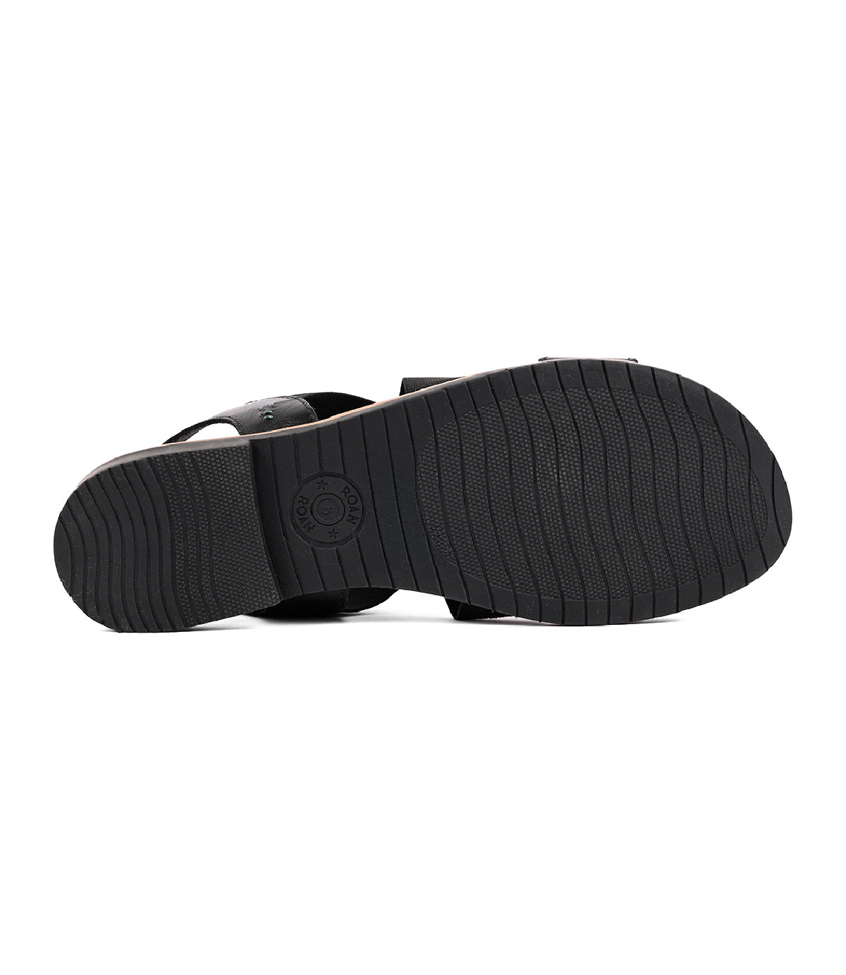 
                  
                    Theodora by Roan features a black rubber sole with horizontal grooves and a circular logo near the heel, providing excellent grip and comfort with its elastic crossover straps.
                  
                