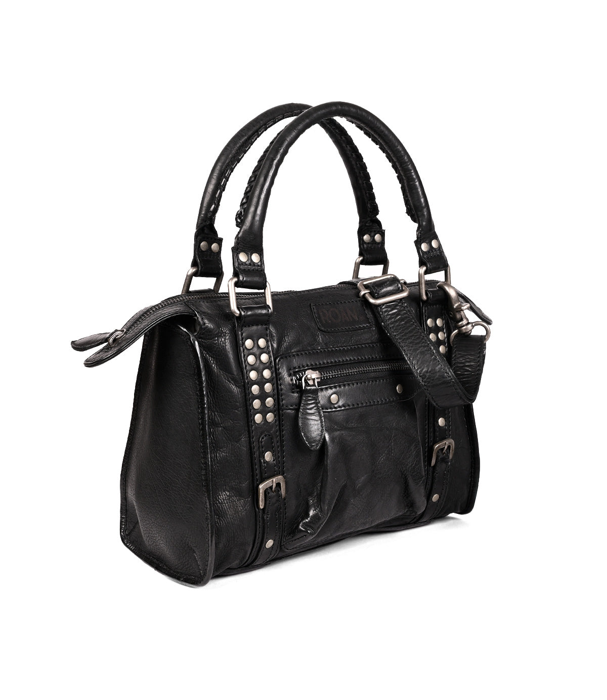 
                  
                    The Roan Visual is a black leather satchel featuring double handles, a detachable crossbody strap, front zip pocket, and bold silver-tone studded accents with buckles.
                  
                